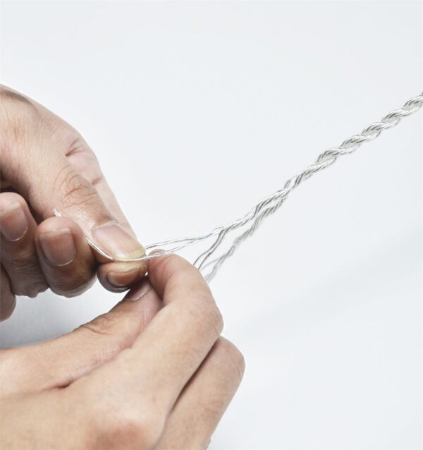 Braiding silver conductors by hand